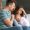 Young,Father,With,Baby,And,Wife,Suffering,From,Postnatal,Depression